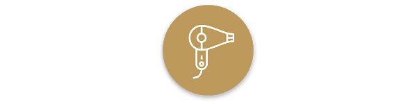 Icon depicting a white hairdryer on a brown circle background.