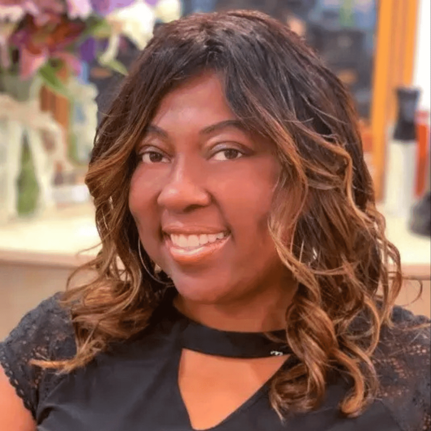 Portrait of Adanus Shanti, a professional stylist at HUE Salon, showcasing their expertise and style.