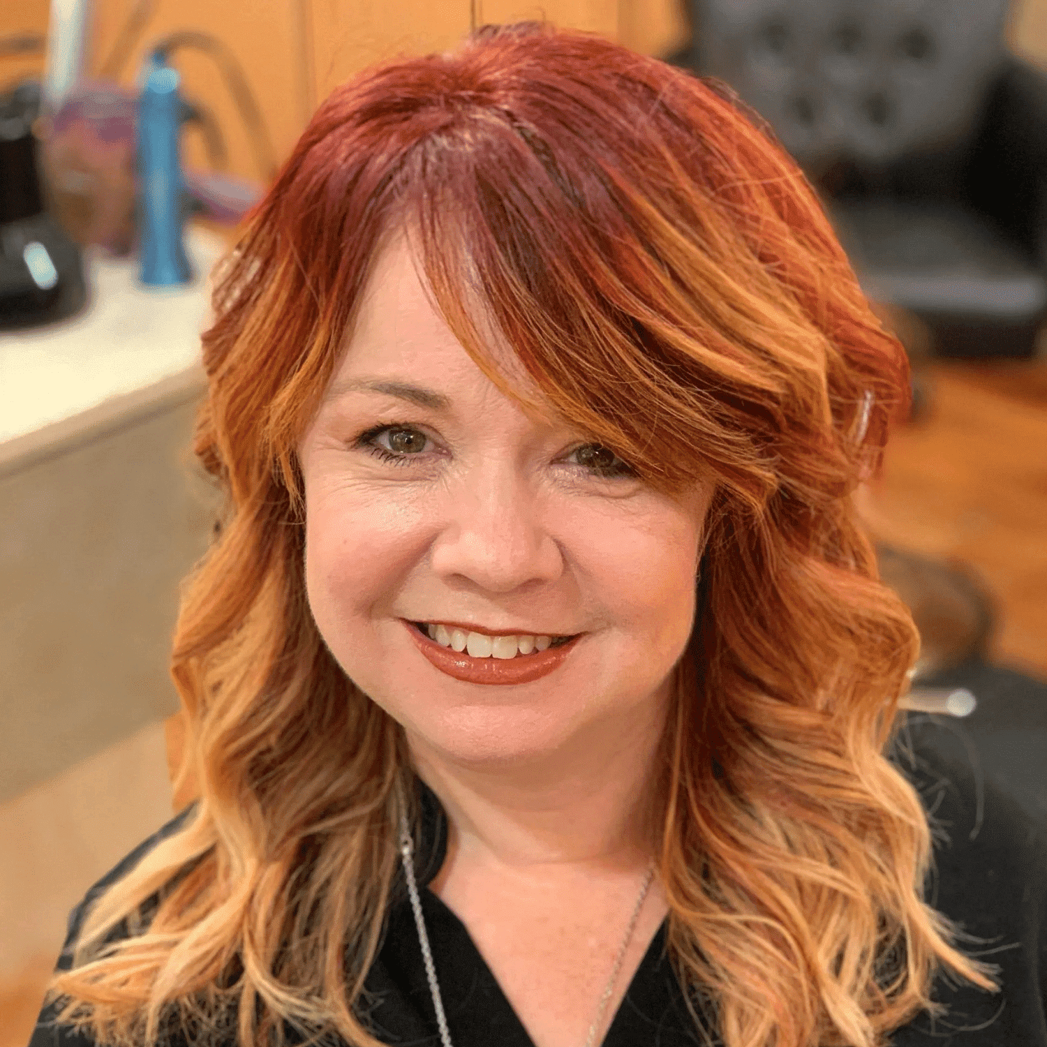 Portrait of Karen Annette, a professional stylist at HUE Salon, showcasing their expertise and style.